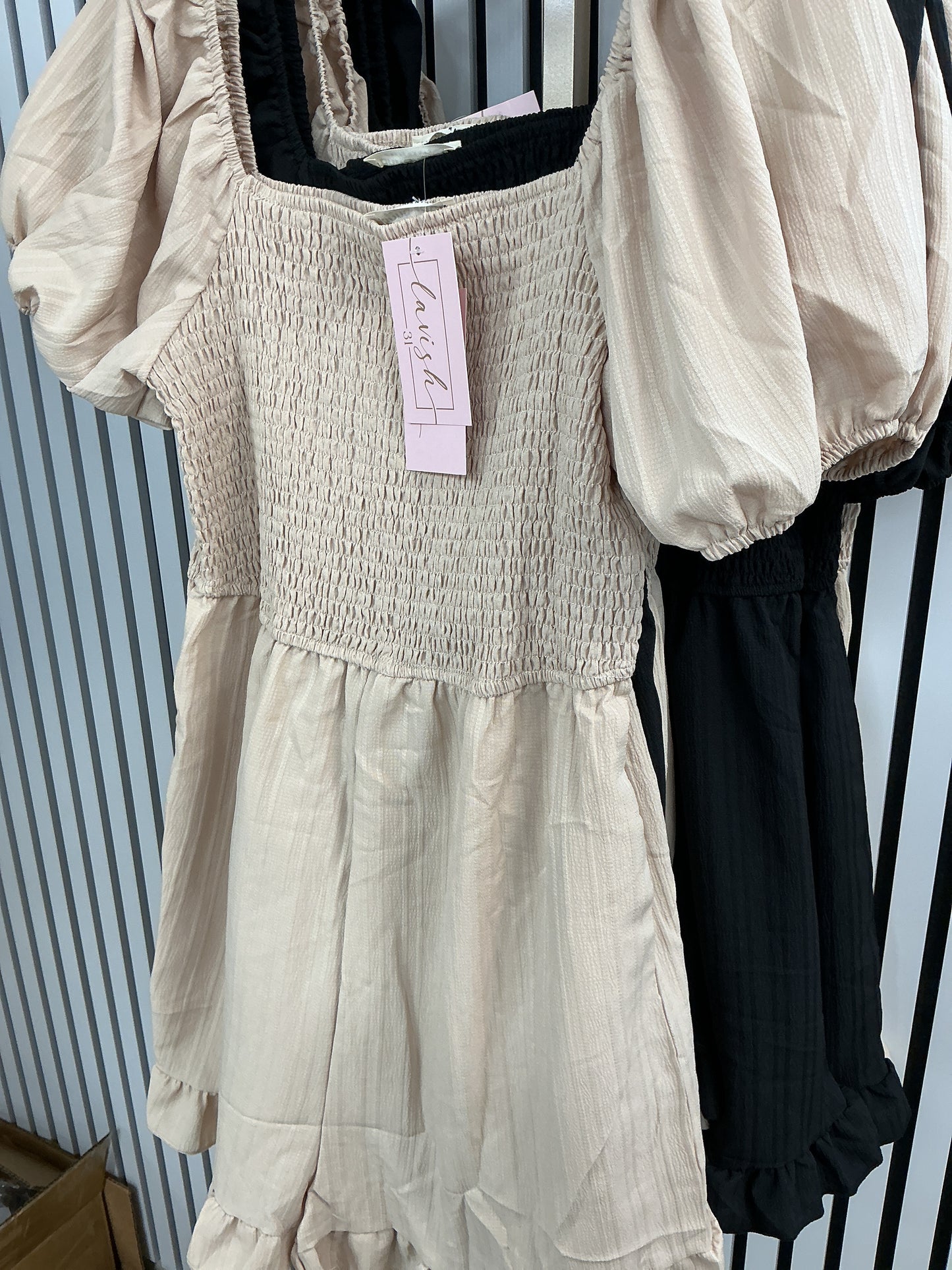 Beige romper with ruffle