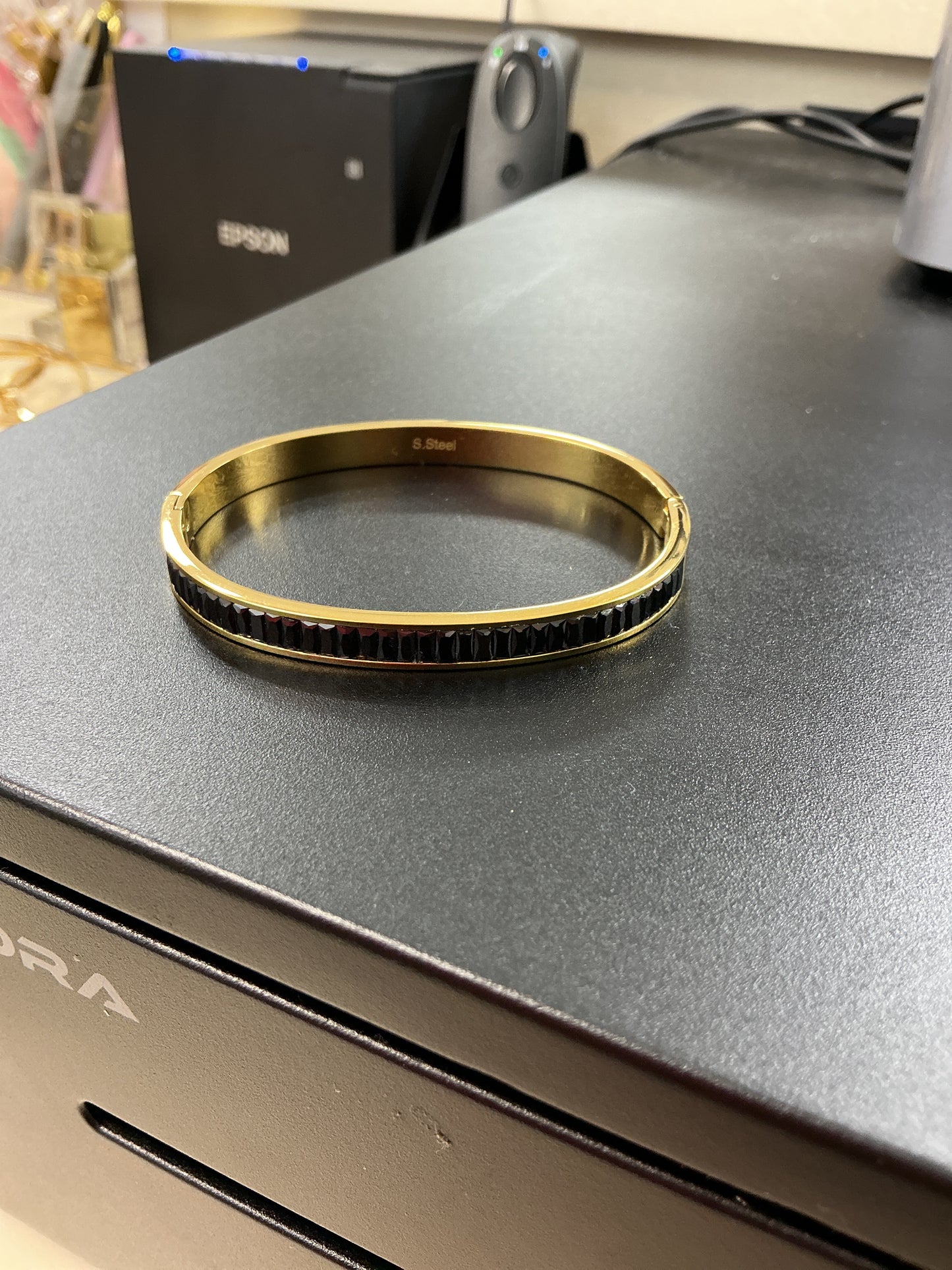 Gold and black bracelet