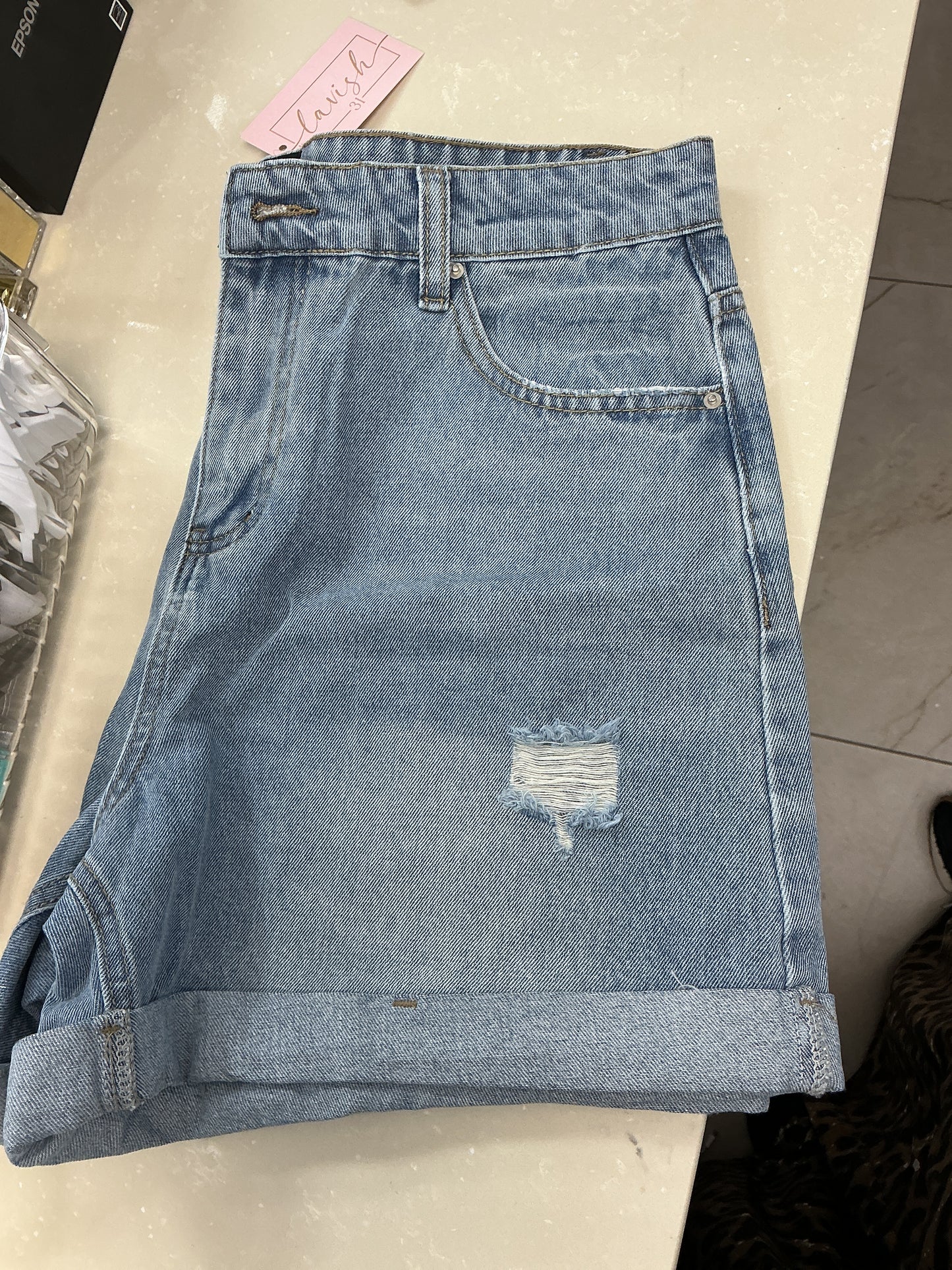 Blue jean shorts with tear