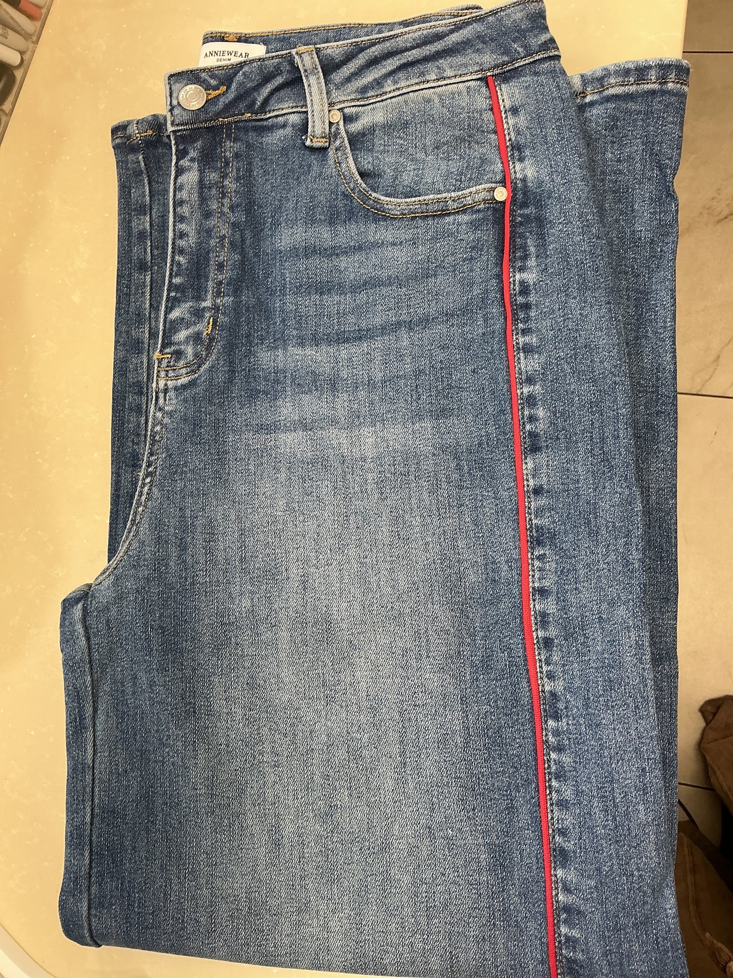 Denim jeans with red stripe