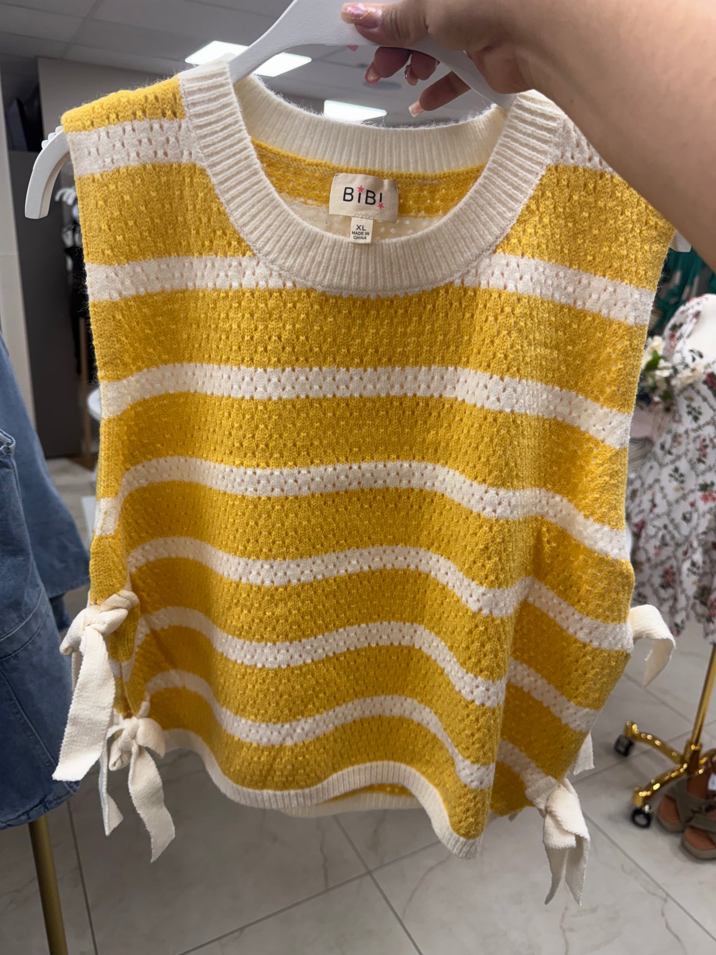 Yellow and white bow vest