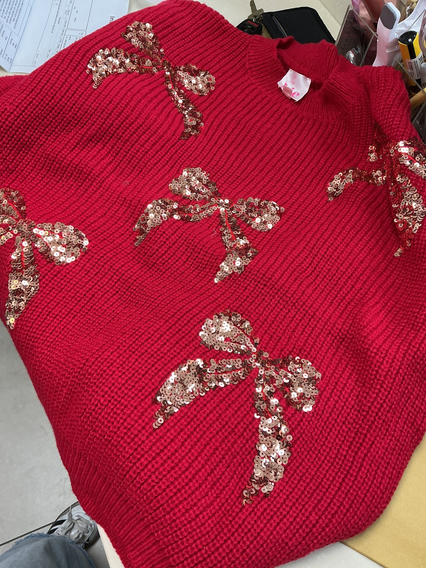Red sweater with bling bows
