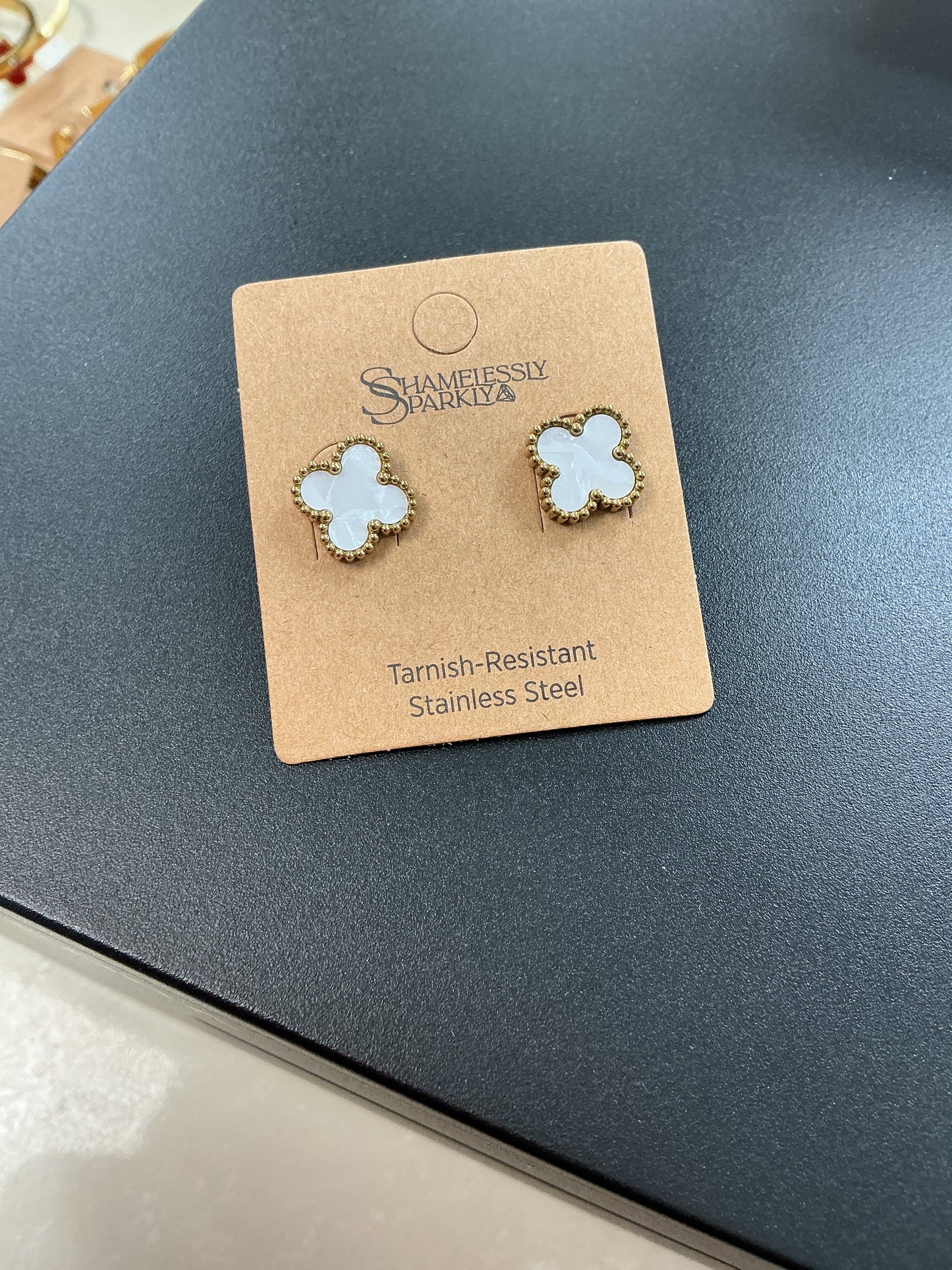 White/Gold four leaf clover
