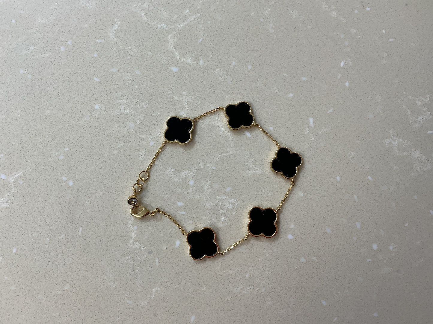 Gold and black / clover bracelet