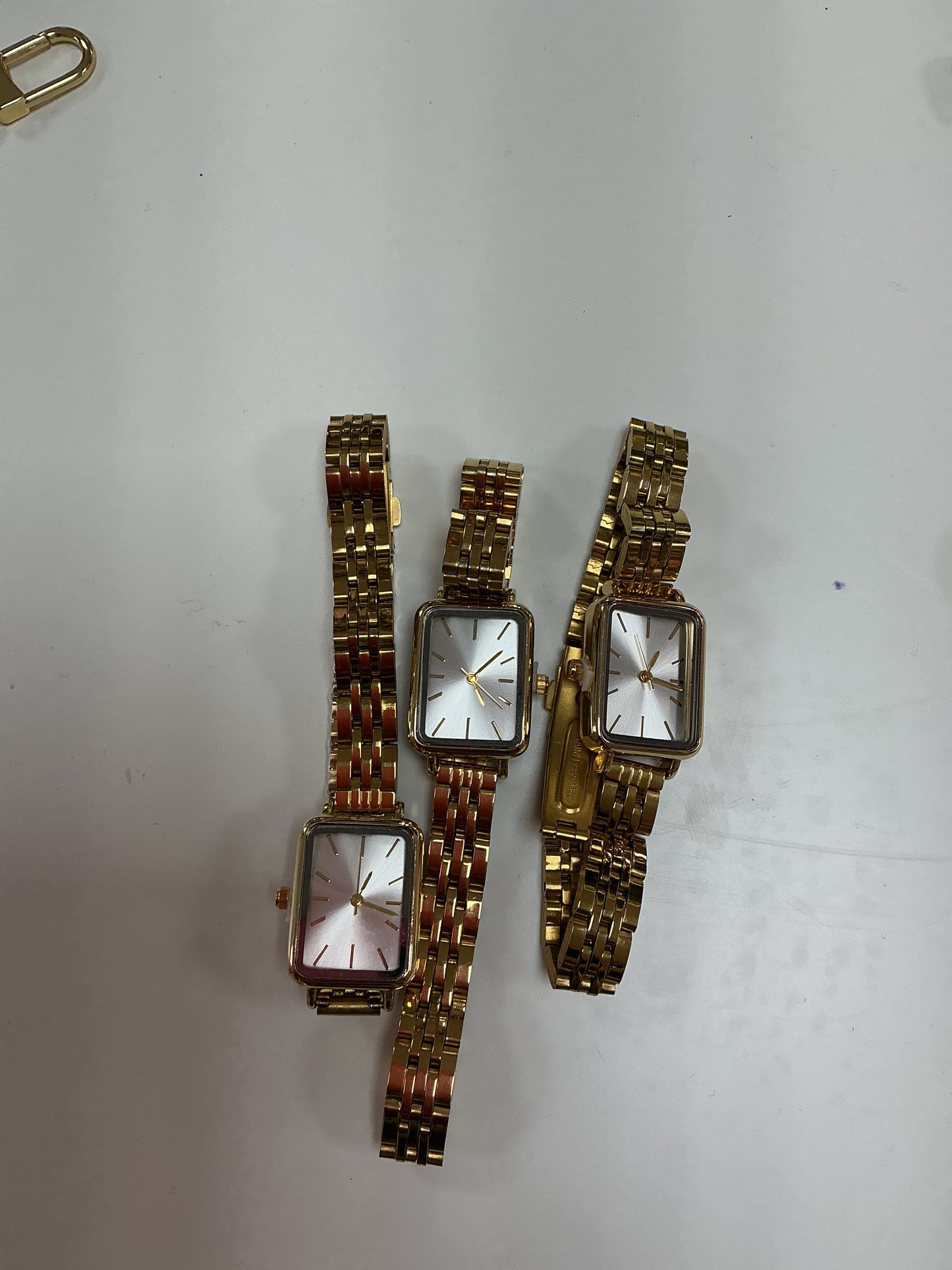 Gold square watch
