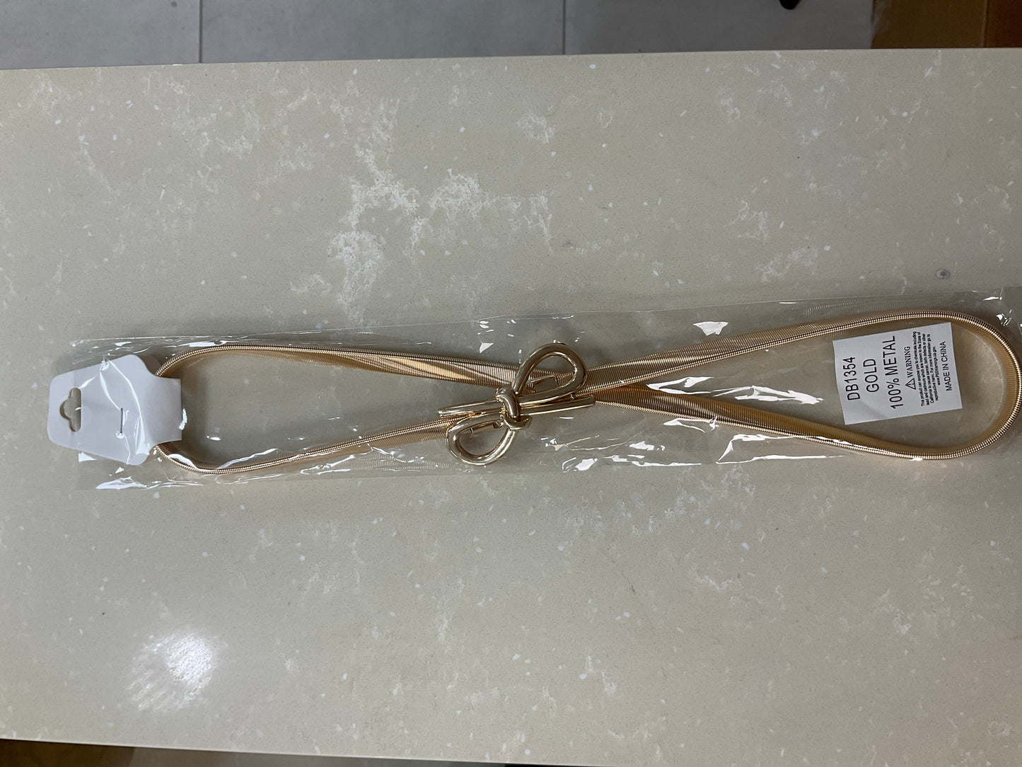 Gold belt with a bow