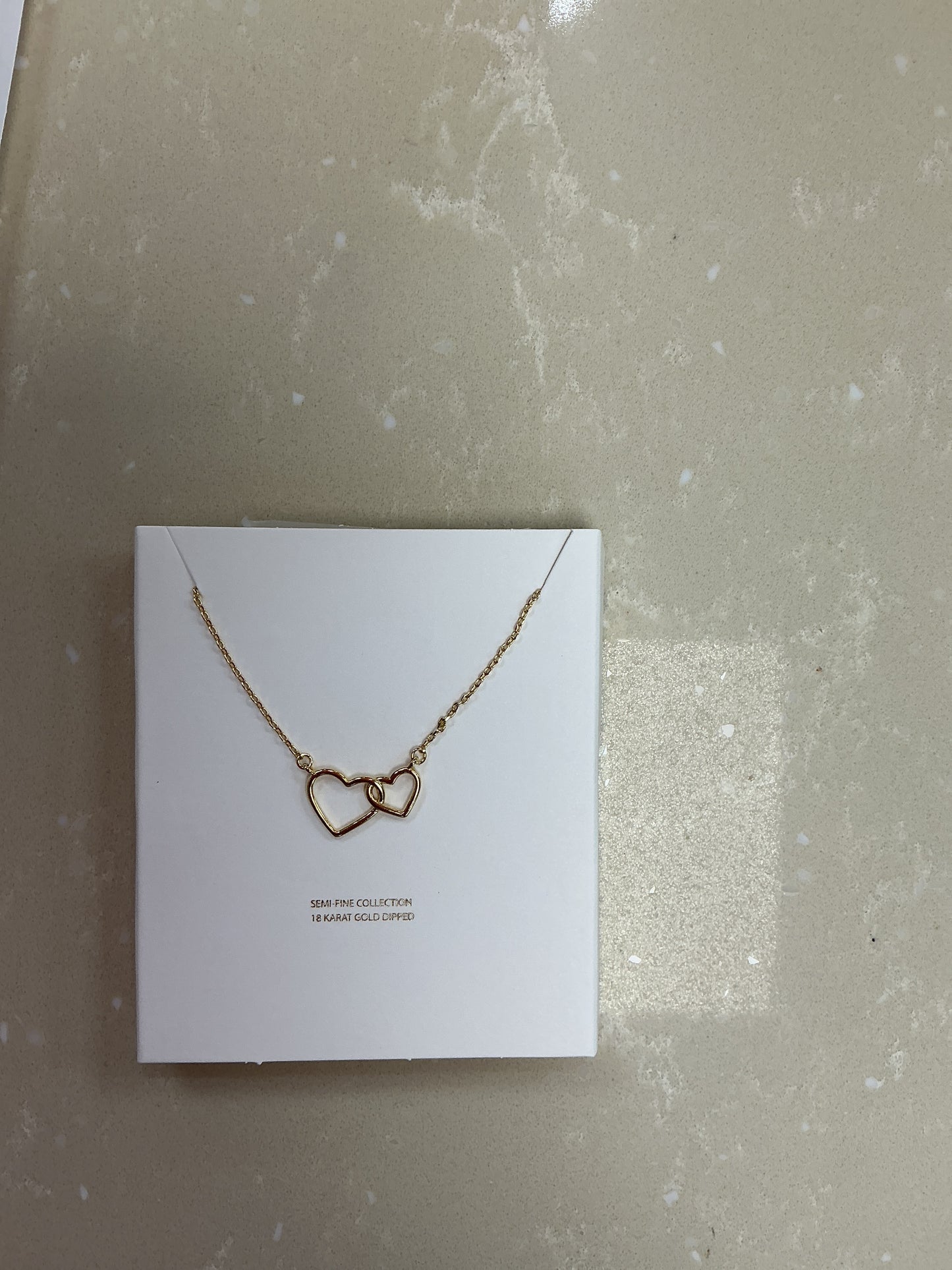 Heart gold interlocking necklace