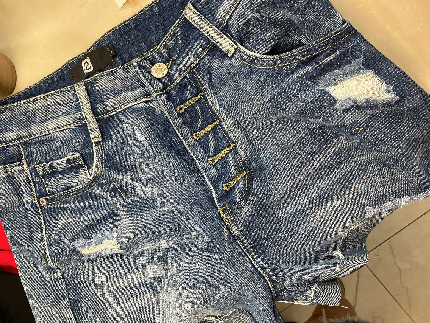 Button fly blue shorts