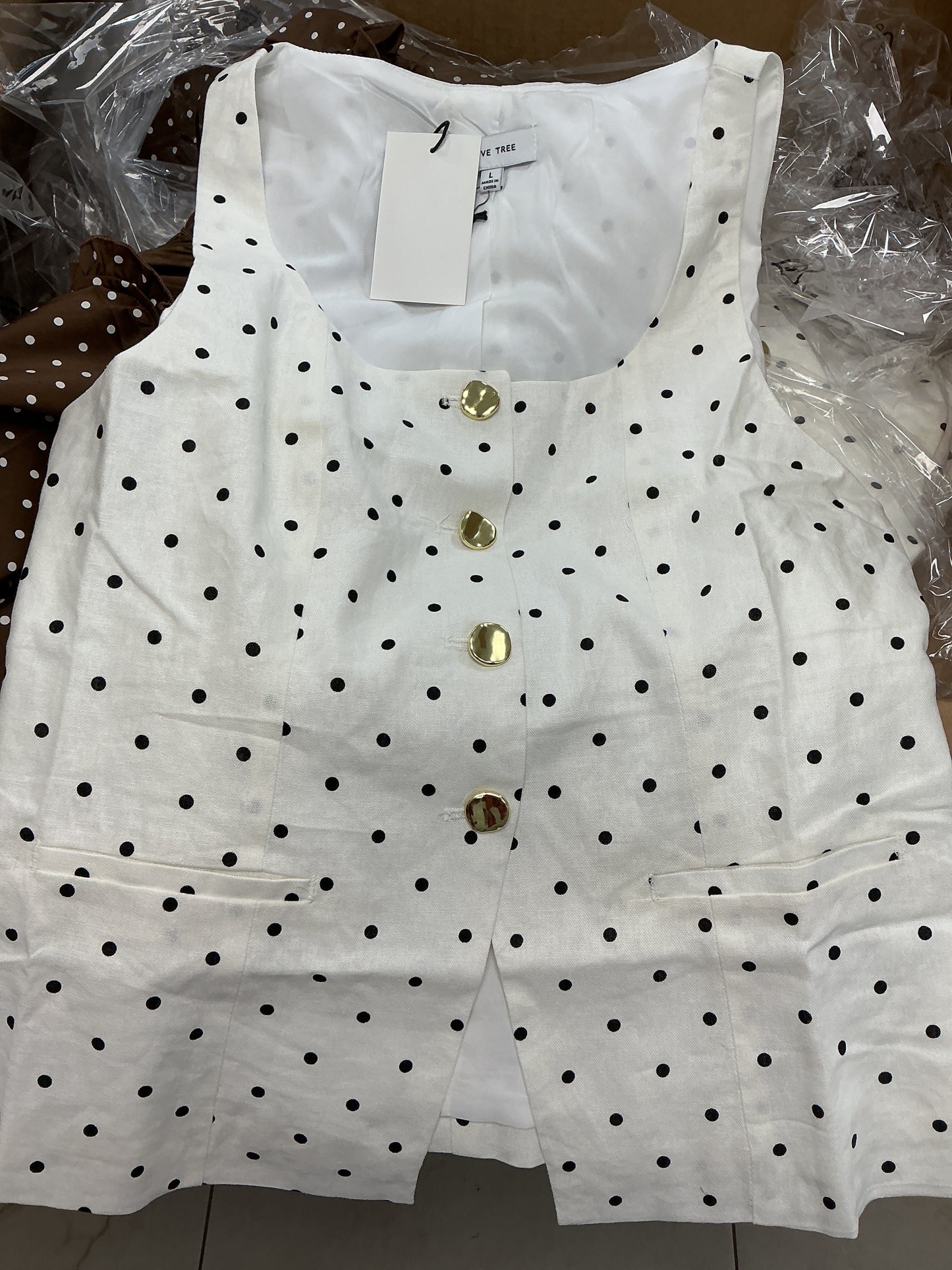 White polkadot vest with gold buttons
