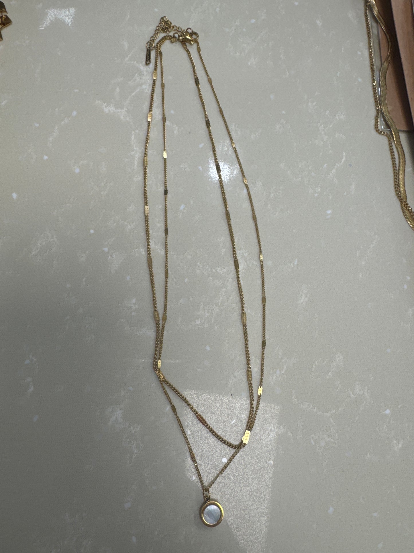 Gold necklace with a pearl