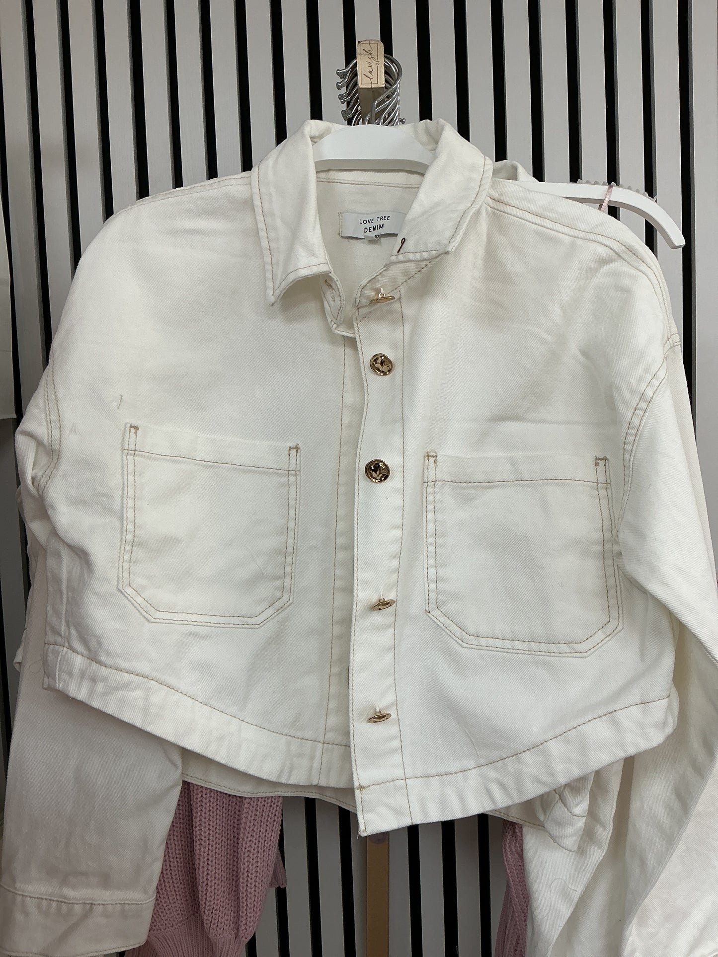 White cropped jacket with gold buttons