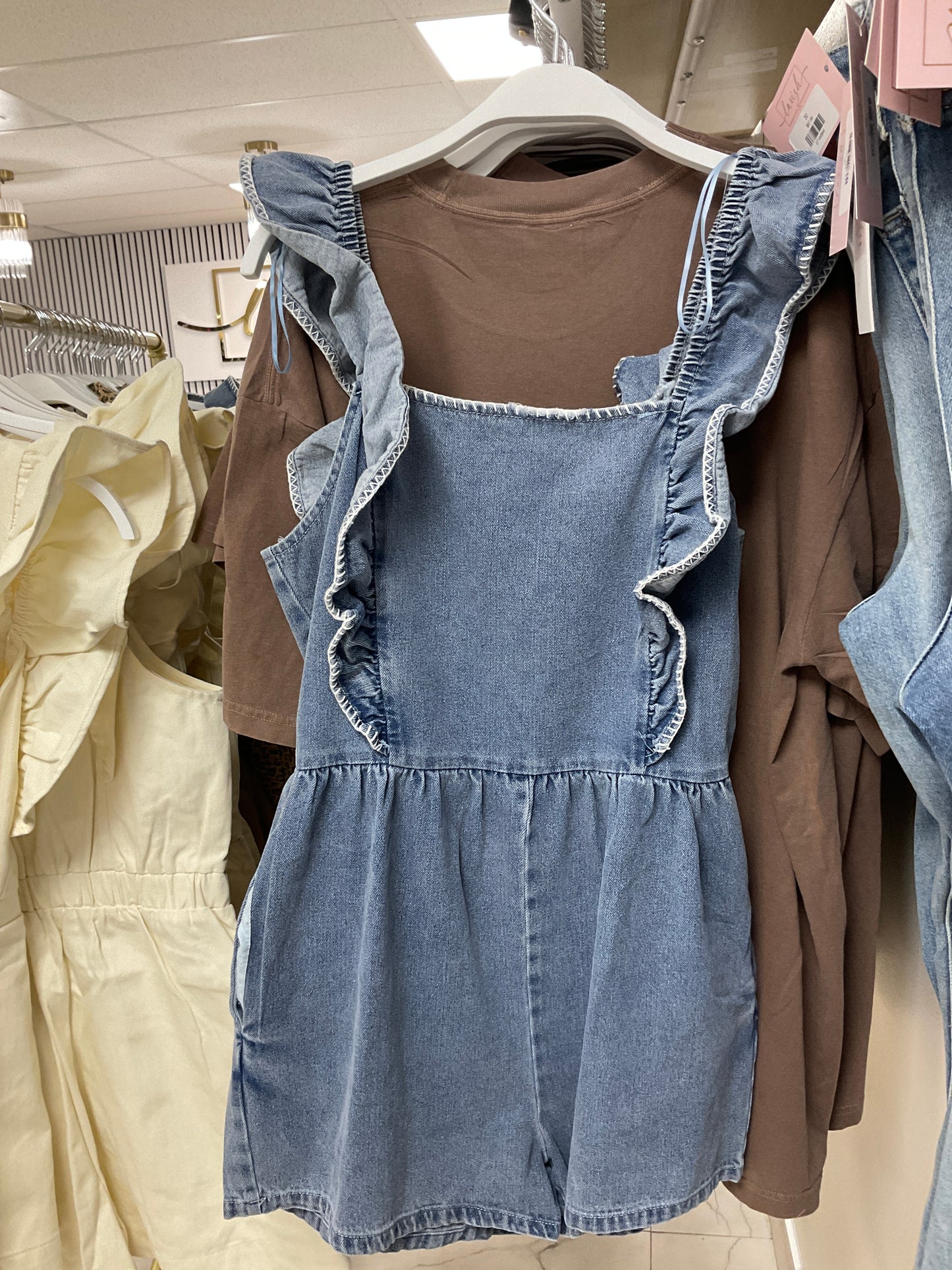 Denim romper with ruffles
