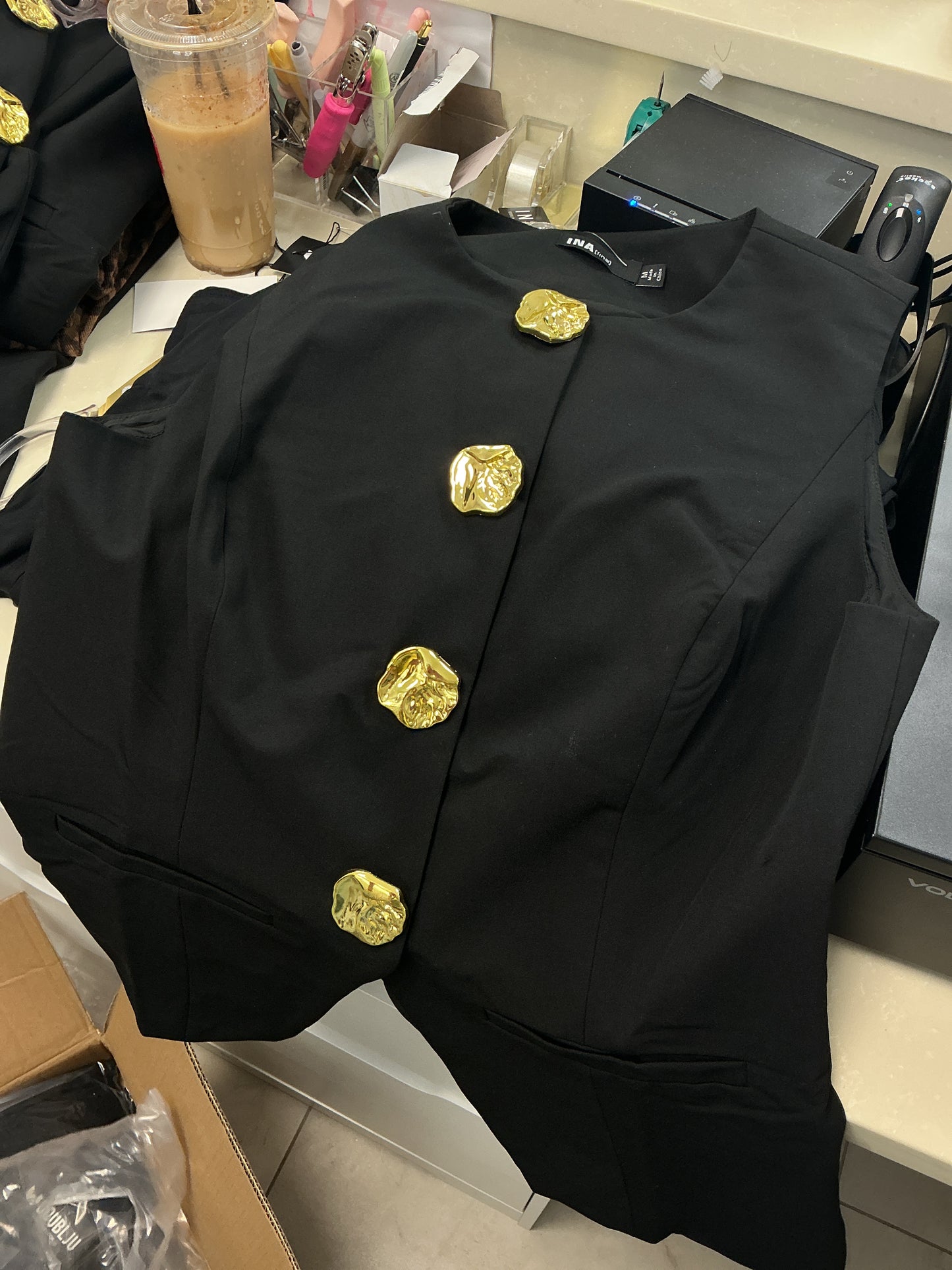 Black vest with gold button
