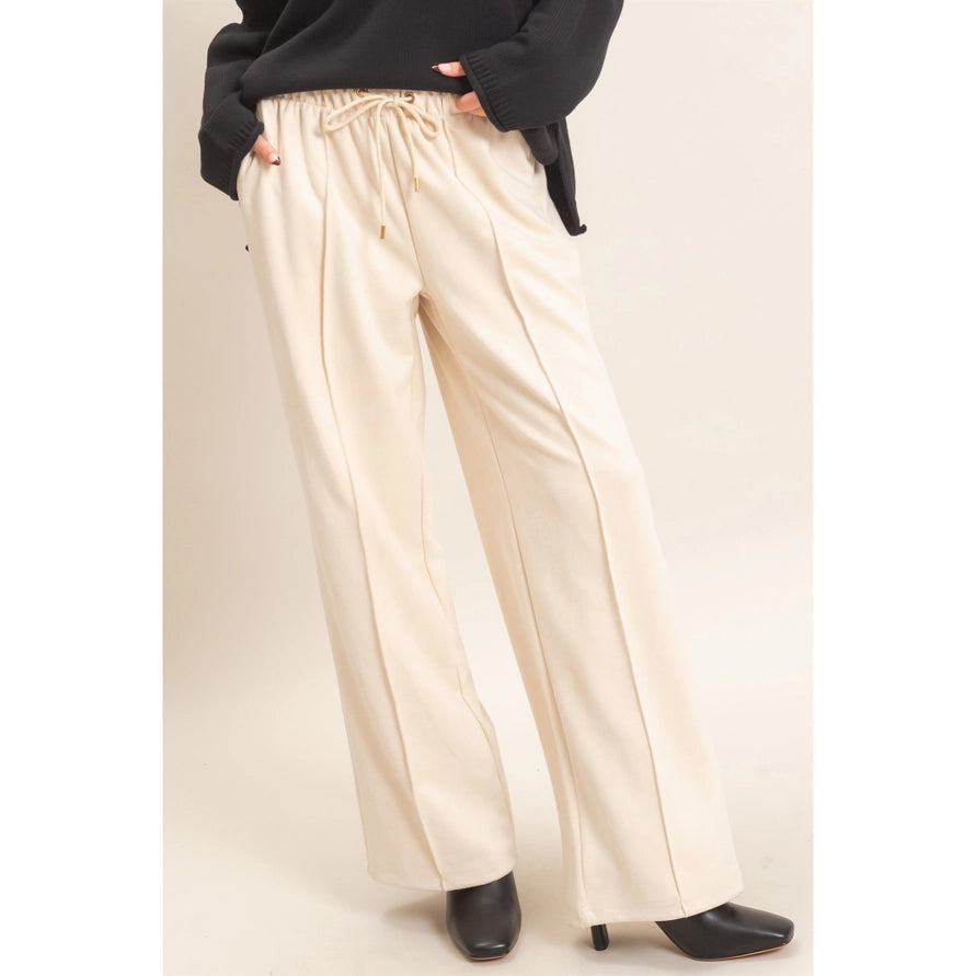 Beige suede pants with a middle line