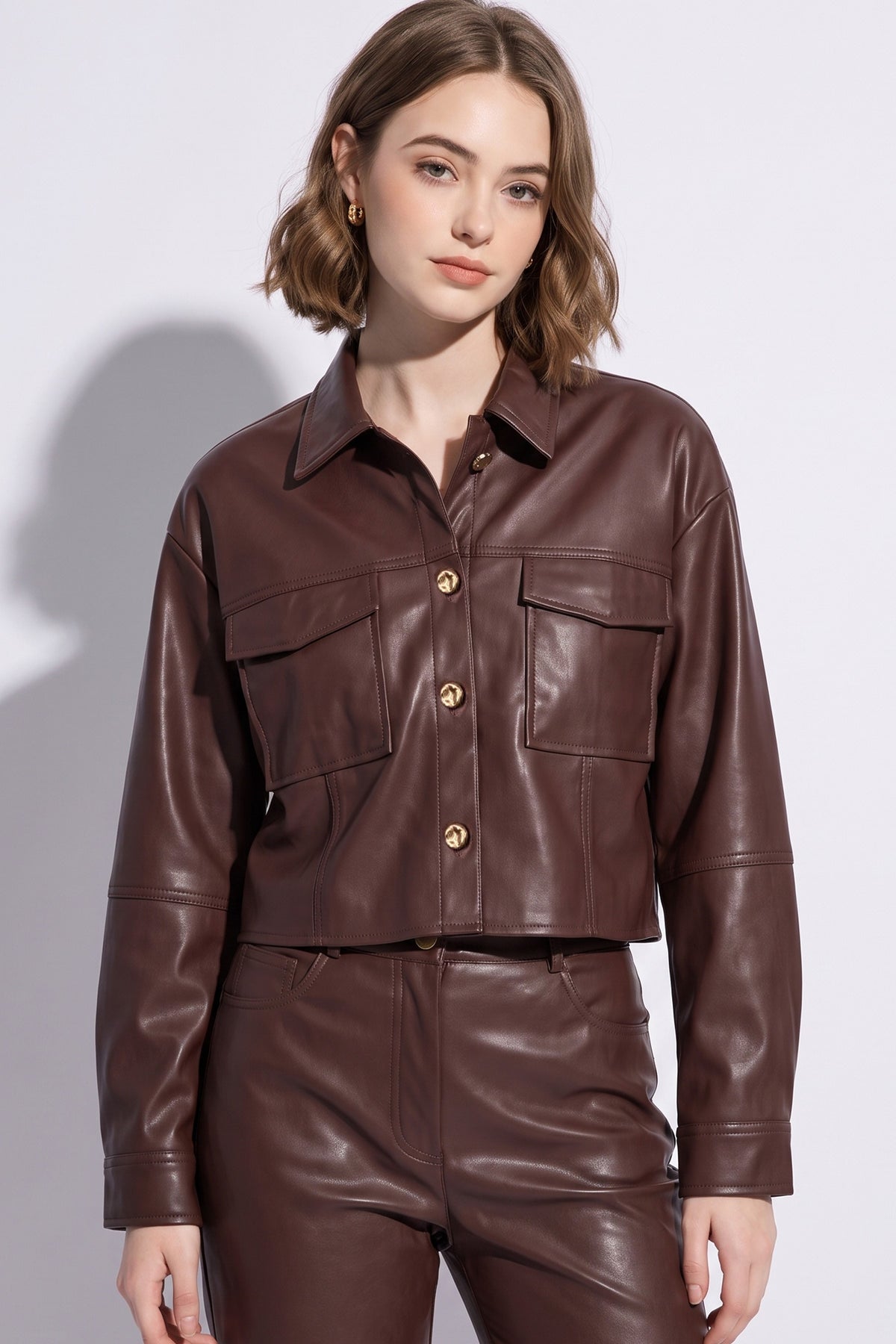 Brown cropped leather jacket with gold buttons